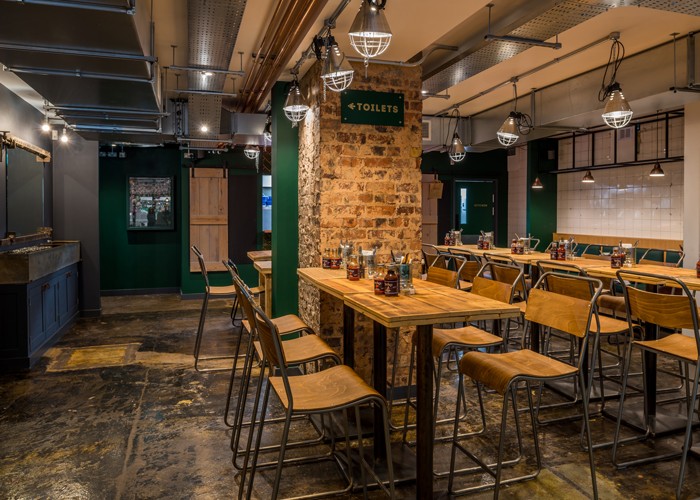 Web-6.-Seating-to-the-rear-of-the-restaurant-includes-taller,-group-dining-tables