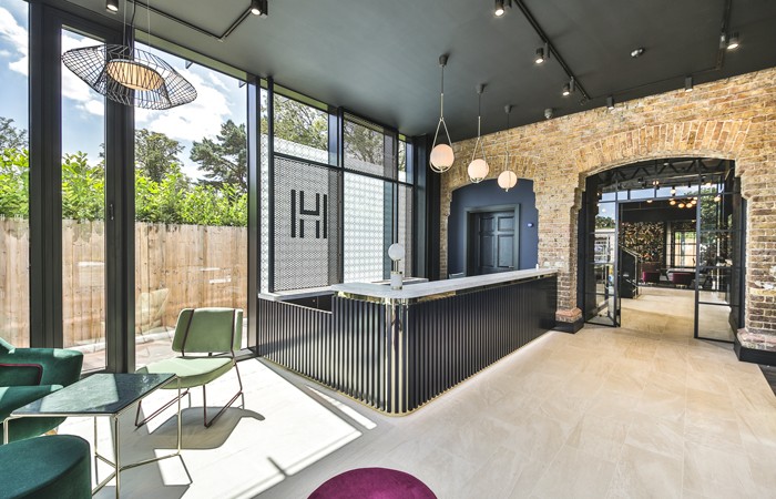 Design-Insider--gatehouse-provides-a-sense-of-arrival,-whilst-separating-out-reception-from-the-student-space-beyond