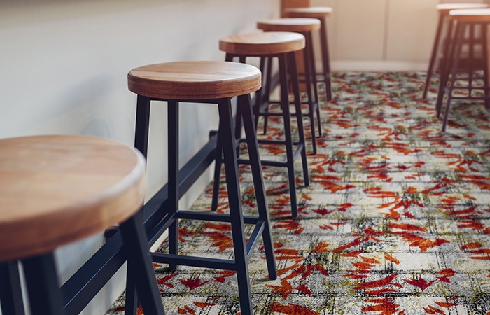 Empty cafe. Wooden chairs beside bar counter. Seats in row